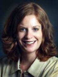 A close-up of a person smilingDescription automatically generated